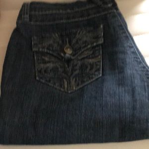 Vintage denim jeans unique back pockets, waist inseam about 28.